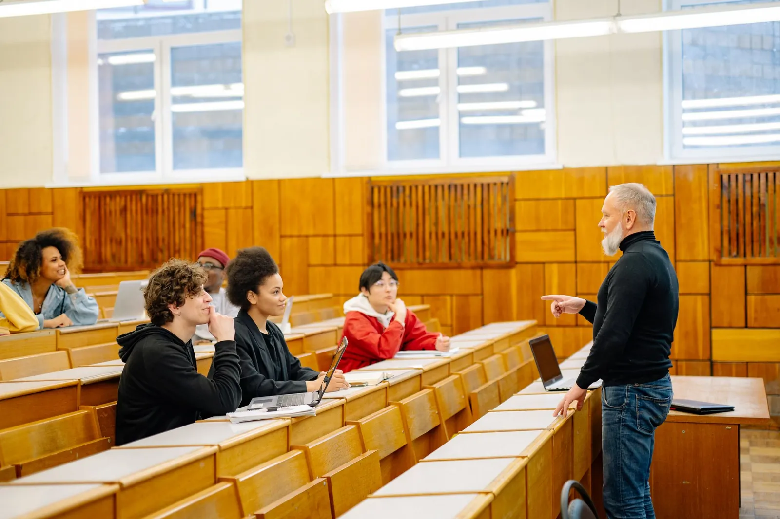 Adult learners in a lecture room with their teacher